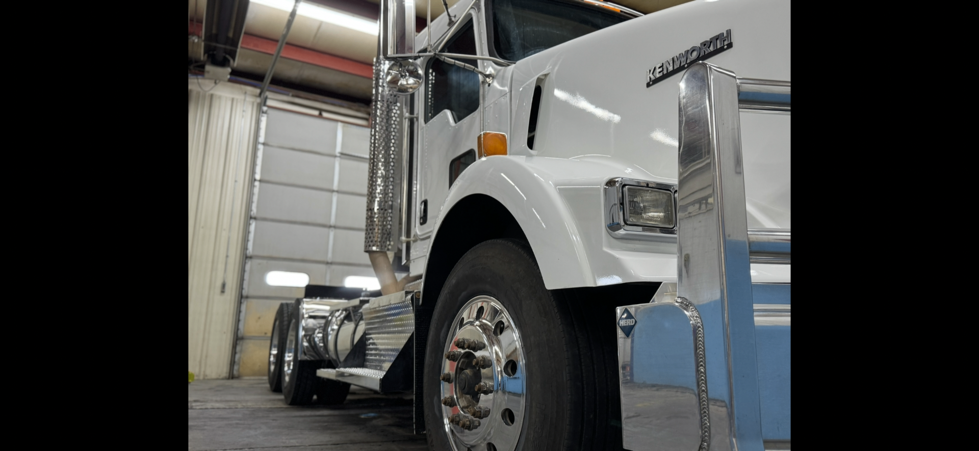 Kenworth semi — fresh white paint and polished chrome
