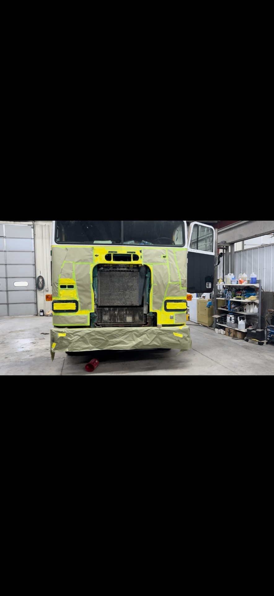 Semi truck front end fully masked for refinishing