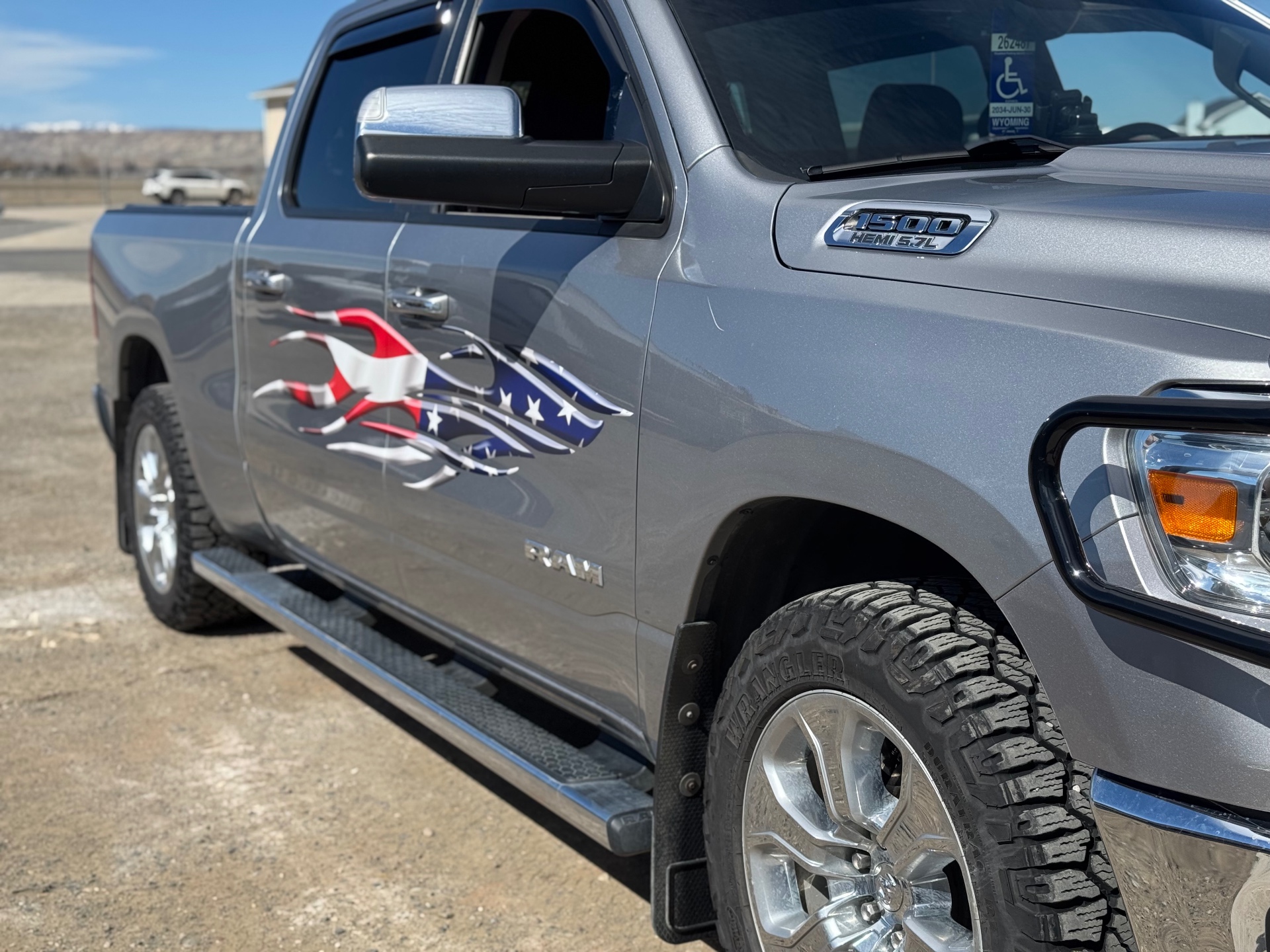 Ram 1500 with custom American flag flames vinyl graphic on door