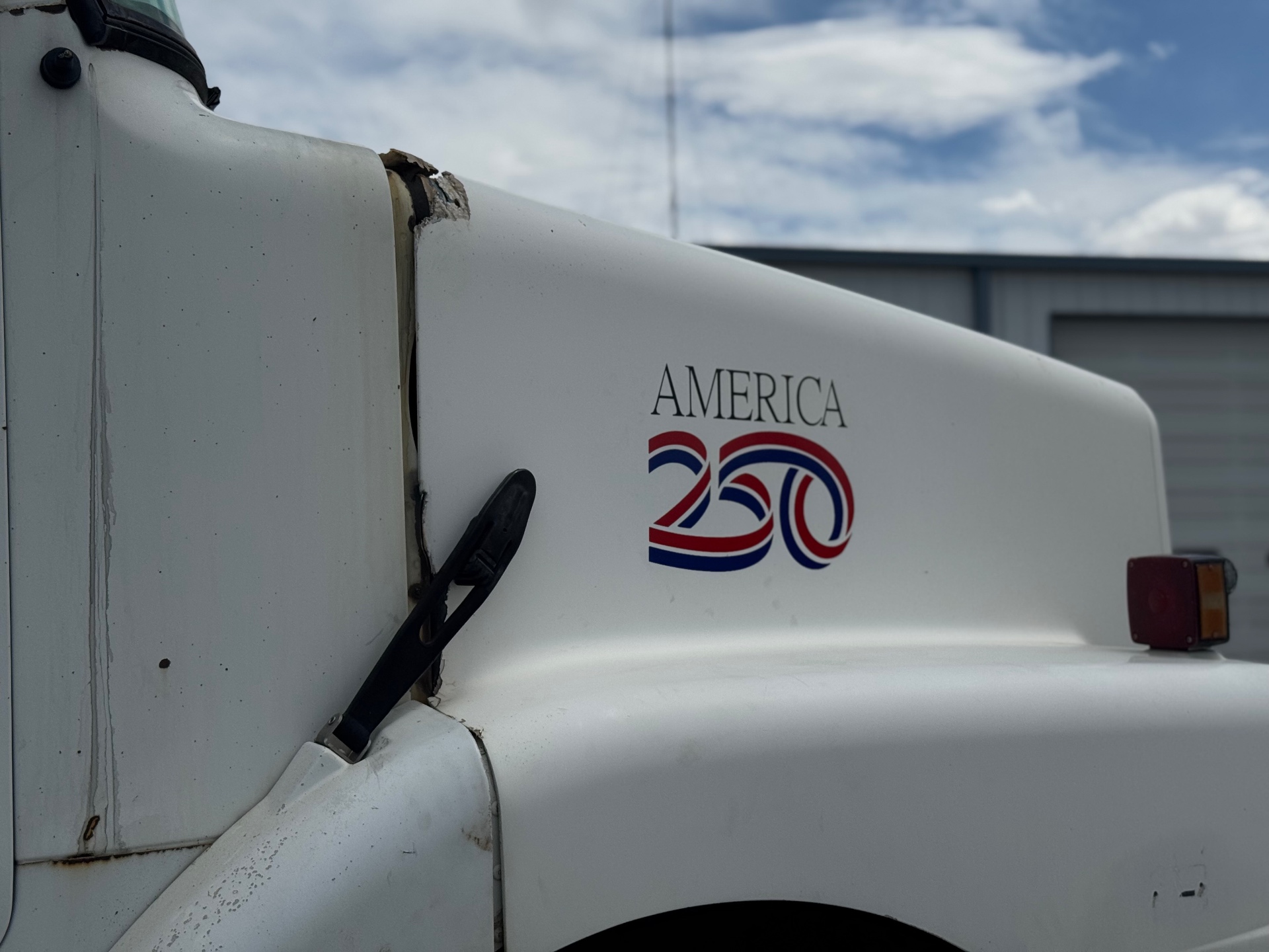 America 250 commemorative decal applied to white truck hood